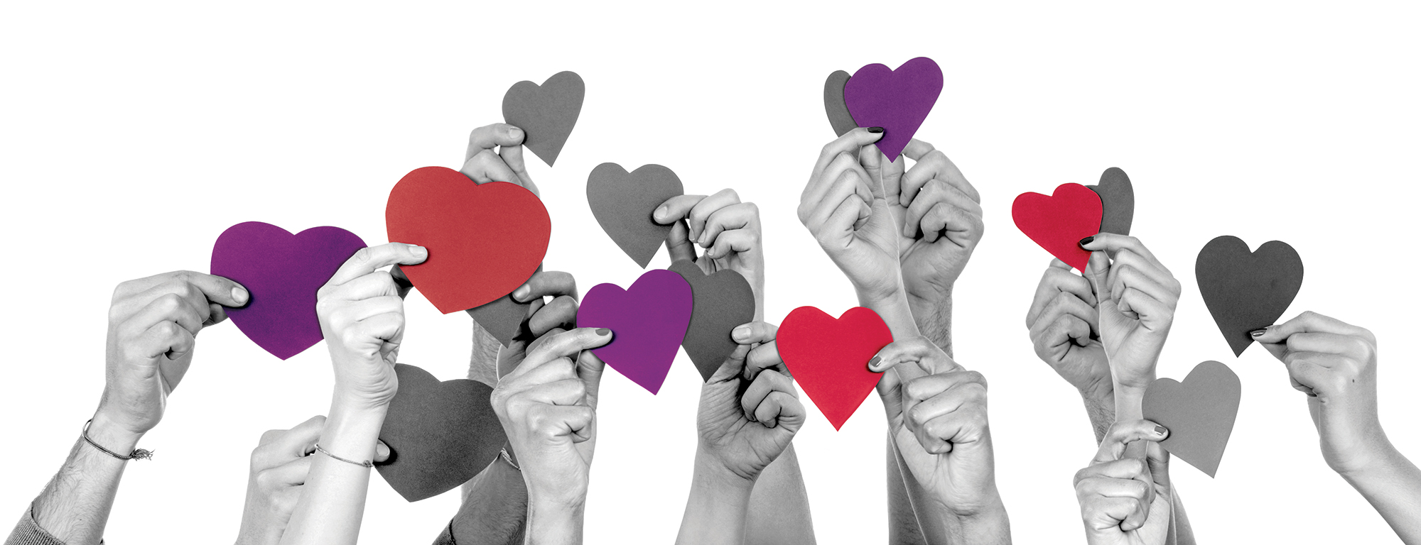 Hands holding paper hearts